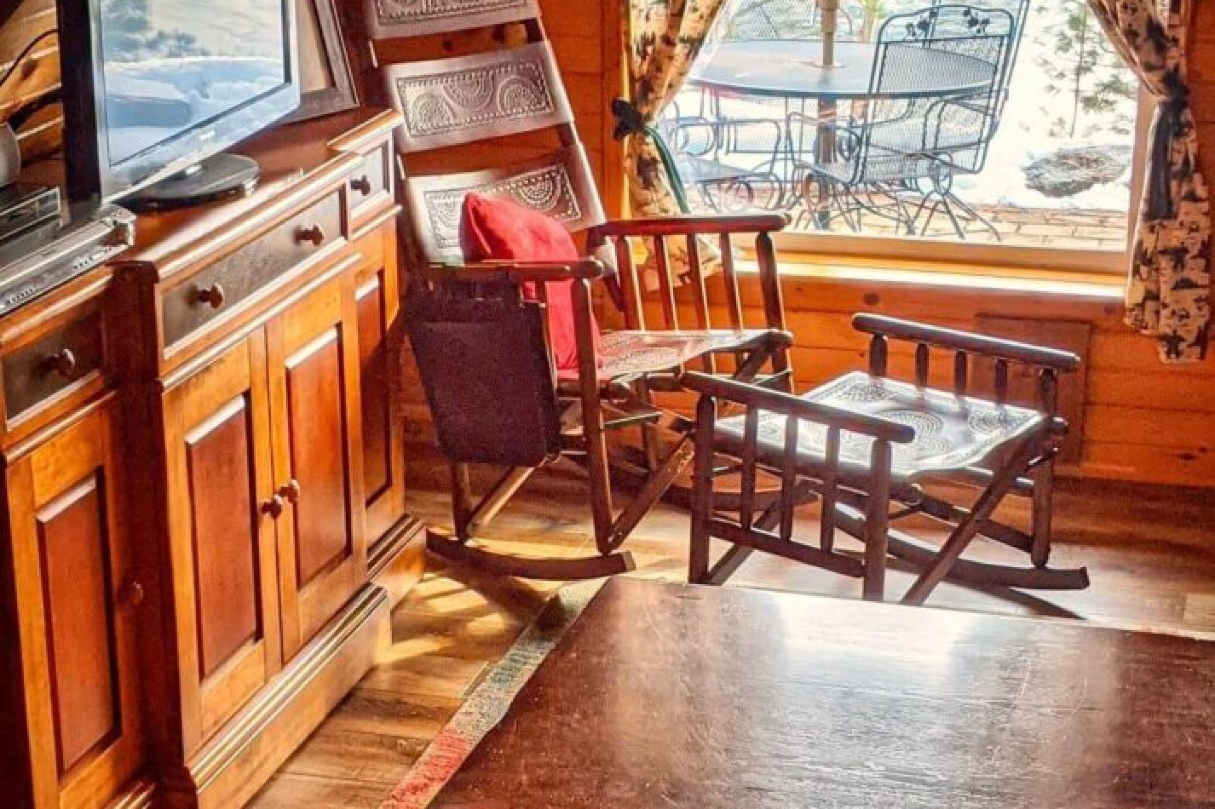 Cozy attic room with wooden furniture.